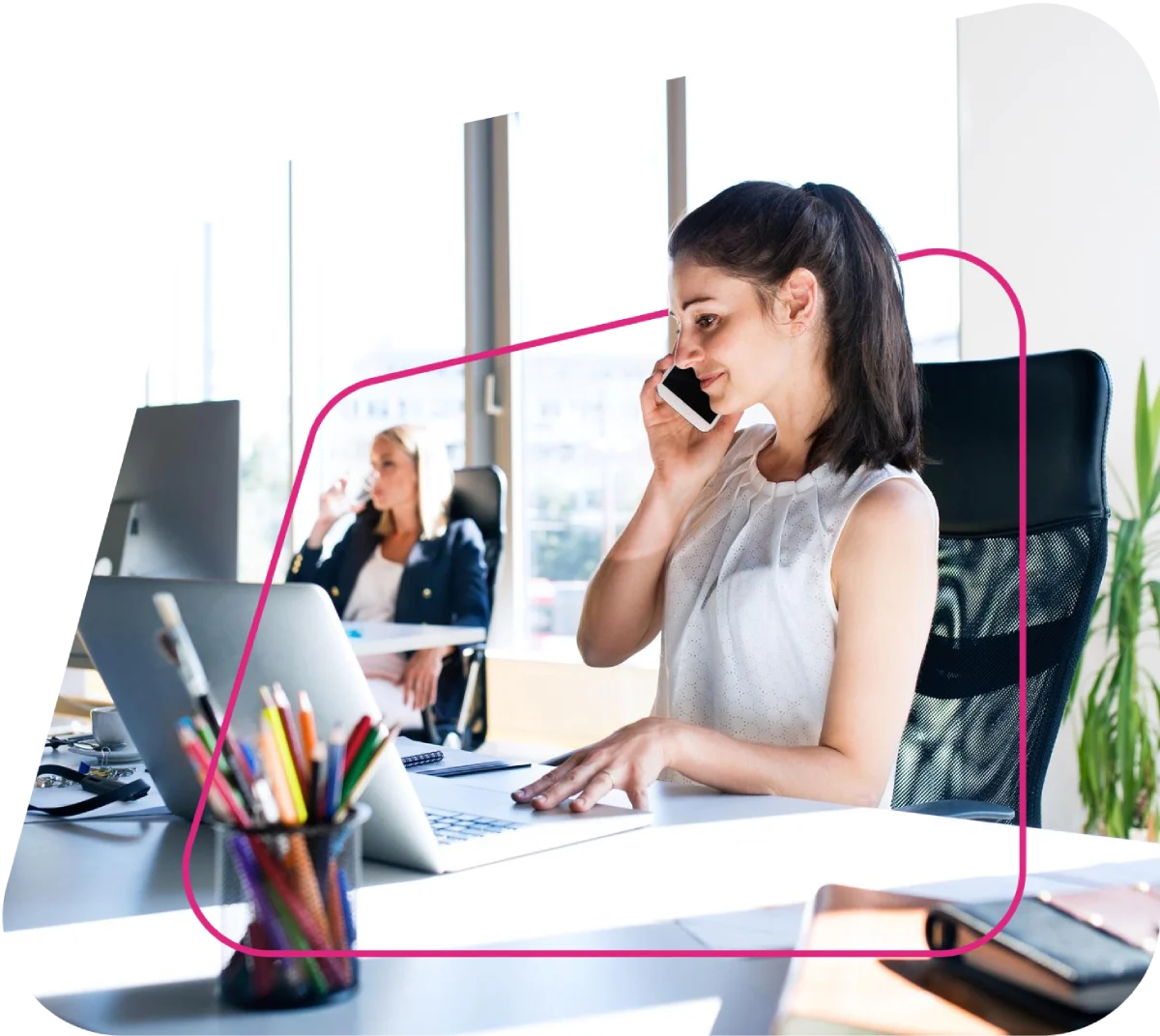 Support executive assisting a client on a laptop